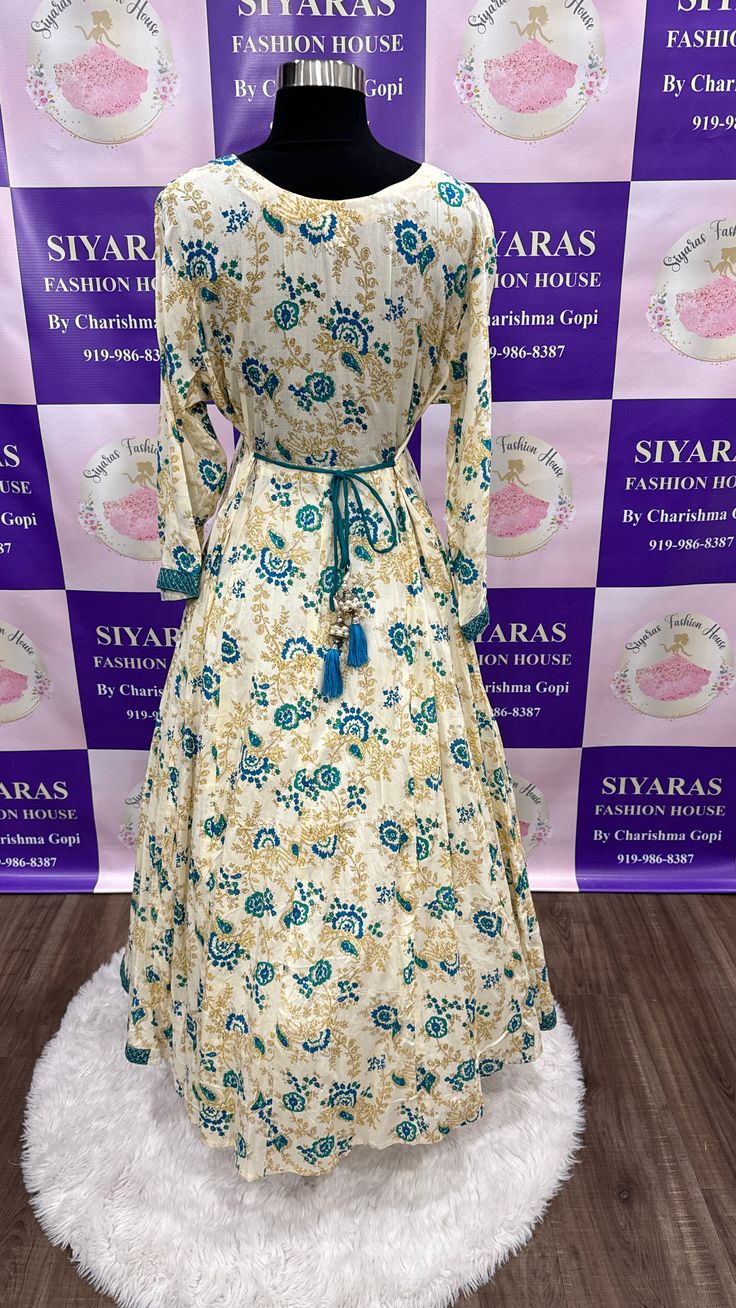 Lovely floral long gown. Fits size 42 to 43.Gown length is 51 Wedding Green Kurta With Floral Print, Green Floral Print Long Sleeve Anarkali Set, Green Long Sleeve Anarkali Set With Floral Print, Green Anarkali Set With Floral Print And Long Sleeves, Multicolor Floral Print Kurta For Weddings, Anarkali Dress With Floral Embroidery, Elegant Floral Print Maxi Length Anarkali Set, Fitted Floral Embroidery Long Gown, Elegant Floral Print Maxi Anarkali Set