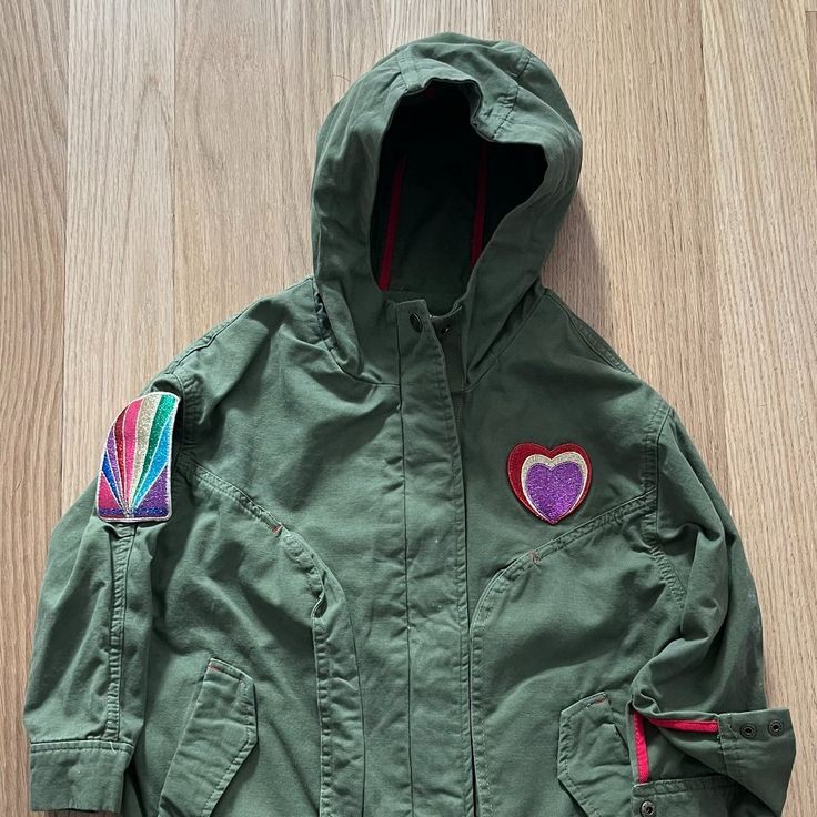 Brand New, Never Worn, Military Style Jacket With Rainbow Marc Jacobs Logo On Back And Embroidered Patches On Arms And Chest. Draw Cord At Back Waist And Elastic Hem. Full Zip Front With Snaps. Olive Color With Multicolor Patches And Red Inside Bindings. Playful Cotton Outerwear For Outdoor, Playful Fall Outdoor Outerwear, Playful Spring Outdoor Outerwear, Playful Long Sleeve Outerwear With Pockets, Playful Winter Outerwear With Pockets, Playful Green Outerwear For Outdoors, Playful Fall Outerwear For School, Playful Green Outerwear For Outdoor, Playful School Outerwear For Fall