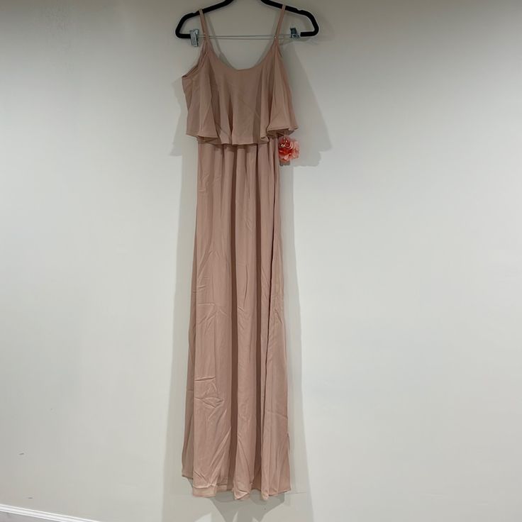 The Caitlin Ruffle Maxi Dress Dusty Blush Crisp And Flows From Top To Bottom. She's Extremely Versatile, So Wear Her As A Classic Spaghetti Strap Or Make Her Into A Cold Shoulder! Beige Flowy Tiered Maxi Dress, Spring Bridesmaid Fitted Ruffle Dress, Summer Fitted Bridesmaid Ruffle Dress, Spring Bridesmaid Ruffle Dress With Ruffle Hem, Spring Bridesmaid Ruffle Dress, Fitted Floor-length Ruffle Dress For Spring, Summer Bridesmaid Ruffle Dress, Beige Chiffon Maxi Dress With Ruffles, Flowy Beige Maxi Dress With Ruffle Hem