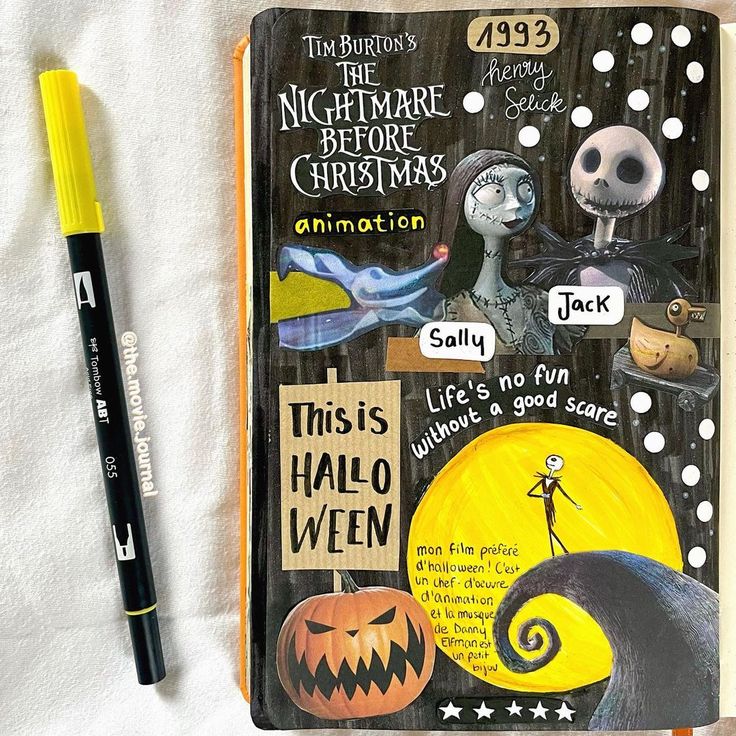 an open notebook with halloween images and words on it next to a marker pen that reads, the nightmare before christmas animation