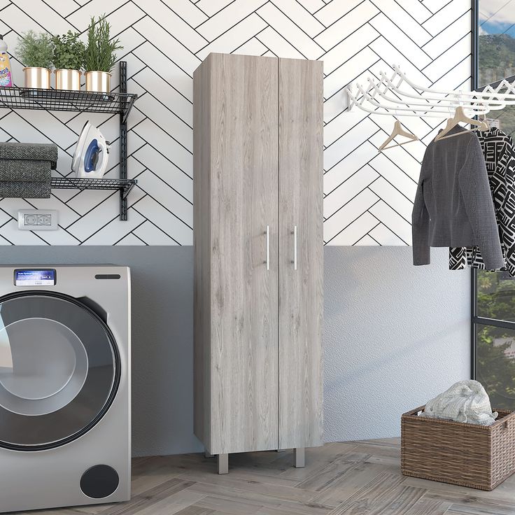 a washer and dryer in a room next to a wall with white tiles