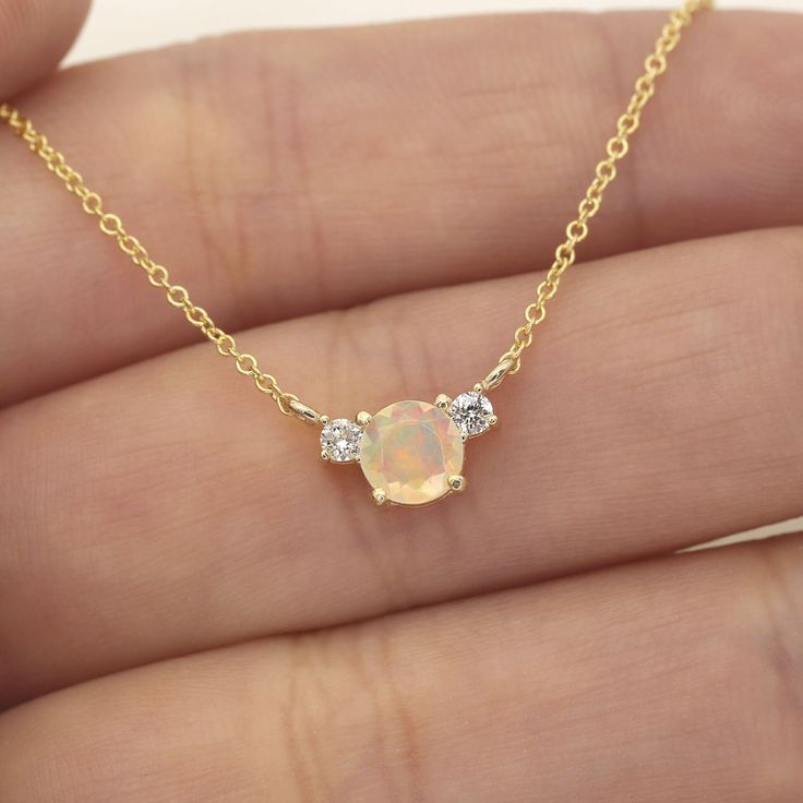 "14k Opal Diamond Necklace | 5.0MM Natural Opal Pendant | October Birthstone Necklace | Opal Charm | Real Gold Necklace | 14k Opal Necklace  P R O D U C T 𝄪 D E T A I L S ✽ October Birthstone. Delicate. Fiery. Magical. ✽ Metal: 14k Yellow Gold, White Gold & Rose Gold ✽ Chain Length: 14\" - 20\" (Classic Rolo Chain) ✽ Center Stone: 5.0 mm Natural Opal (approx. 0.5ct) ✽ This is Natural Opal. Each opal has different colors. ✽ Diamond Size: 2.0 mm x 2pcs (total 0.06ct) ✽ Diamond Color: G ✽ Diamond Opal Diamond Necklace, Opal And Diamond Necklace, Gold Opal Jewelry With Round Cut, Formal Opal Necklace With 17 Jewels, Formal Opal Round Necklace, Formal Round Opal Necklace, 14k Gold Necklaces With Gemstone Accents For Anniversary, 14k Gold Necklace With Gemstone Accents For Anniversary, Elegant Opal Clavicle Chain Jewelry