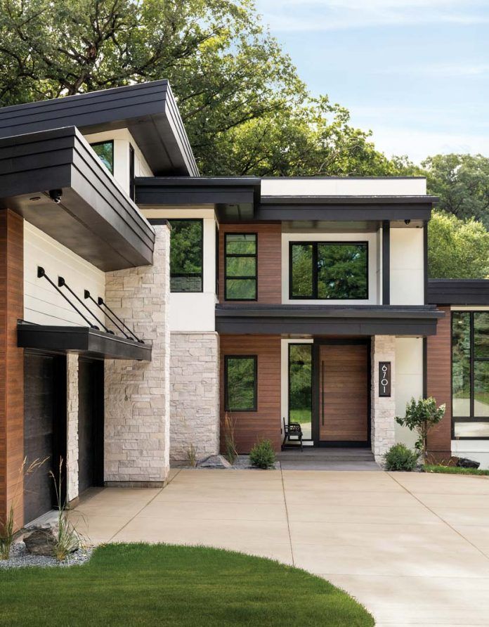 a modern house with brown and white exterior