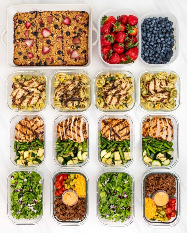 the meal prepped in plastic containers is ready to be eaten and put into lunch boxes