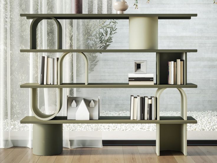 a book shelf with books and vases sitting on it's sides in front of a window