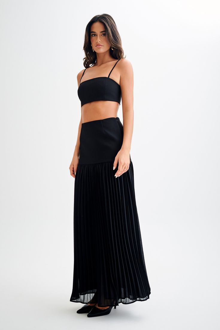 Going with the flow.The JILLIAN Pleated Maxi Skirt is a sophisticated and elegant addition to any wardrobe. This high-waisted skirt features a fitted yoke that transitions into a beautifully pleated chiffon lower skirt, offering a graceful flow and movement. With its maxi length, it exudes timeless charm. Pair it with the Letitia Suiting Halter Top with Buckle for a chic and polished ensemble. Black Sheer Skirt, Capsule Wardrobe Accessories, Going With The Flow, European Summer Outfits, Maxi Dress Sale, Sheer Skirt, Pleated Chiffon, Pleated Maxi Skirt, Capsule Outfits