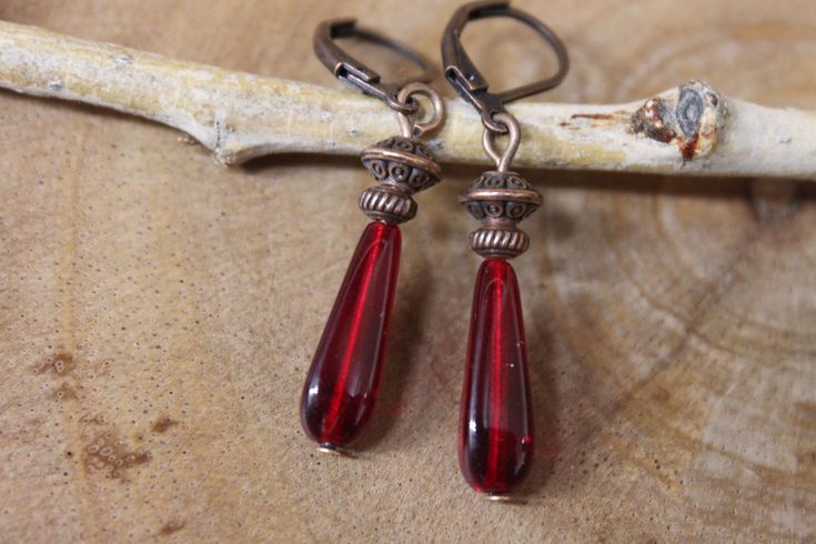 Deep Red teardrop Czech glass earrings made with copper findings and antique copper tone lever backs ( lead and nickel free). Color : Red teardrop Czech Glass beads Finish:  Antique copper tone findings Length: 1.5 inches from the top of the ear wires to the bottom For more choices on my Czech Glass earrings, please refer to the link below: https://www.etsy.com/shop/NtikArtJewelry?ref=seller-platform-mcnav&section_id=16062218 To visit my shop " NtikArtJewelry" : https://www.etsy.com/shop/NtikArt Vintage Red Copper Earrings, Red Earrings Dangle, Czech Glass Jewelry, Red Jewelry, Earrings Red, Red Earrings, Christmas Gifts For Women, Gift For Wife, Glass Earrings