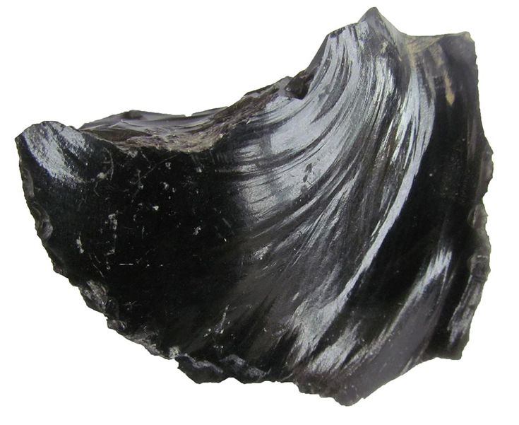 a piece of black rock with white streaks on it