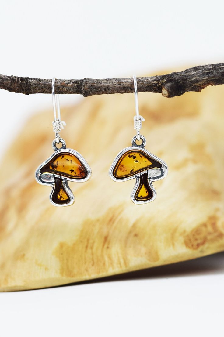 Materials: Sterling Silver 925, Real baltic amber Mushrooms Earrings Dangle Drop, Mushroom Jewelry, Mushroom Gift, Sterling Silver Mushroom Earrings, Amber jewelry, Mushroom lover Earring length 1 1/4 in Pendant length 1/2 in www.etsy.com/shop/HandmadeNordicGifts?section_id=32386755 IMPORTANT The product picture may display minor variations to the actual stone, due to the composition and natural properties of gemstones. Mushroom Jewelry, Amber Jewelry, Jewelry Earrings Dangle, Dangle Drop Earrings, Dangle Earrings, Jewelry Earrings, 925 Sterling Silver, Etsy Accessories, Gift Card