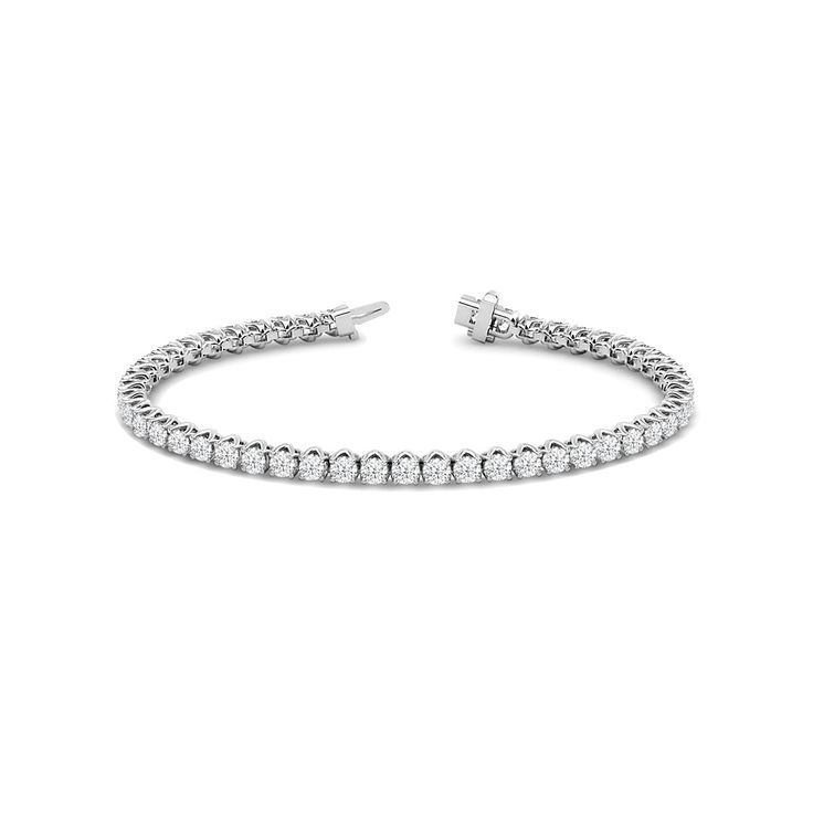 A tennis bracelet displaying a pared-back yet bold aesthetic. This piece features a continuous line of round diamonds set in a decorative tulip basket. This sparkly and elegant piece comes with that little bit of extra style to distinguish itself from the rest. Tulip Basket, Bold Aesthetic, Round Diamond Setting, Bracelet Display, Gorgeous Engagement Ring, Diamond Tennis Bracelet, Continuous Line, Tennis Bracelet Diamond, Halo Engagement Ring