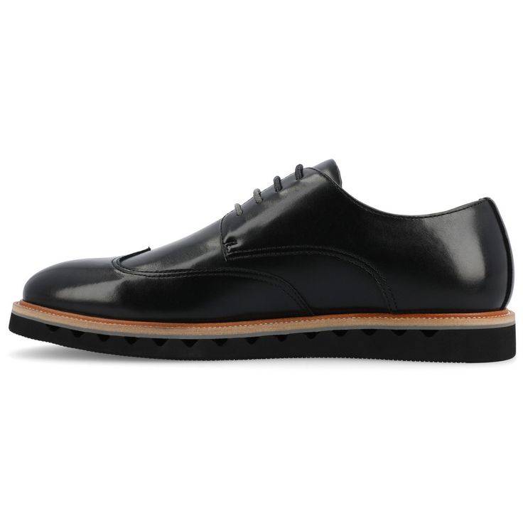 Introducing the Evander derby shoe from Vance Co., a seamless fusion of style and comfort with its 1-inch heel, lace-up closure, and classic round toe design. Crafted from faux leather this style offers a fashionable choice for various occasions. The mesh lining, 6 mm Tru Comfort Foam™ footbed, and rubber outer sole ensure breathability, comfort, and support, making the Evander a versatile and conscious addition to your footwear collection. Derby Oxfords With Stitched Sole, Masculine Oxfords For Derby With Stitched Sole, Leather Oxfords For Derby, Plain Toe Oxfords With Stitched Sole For Derby, Modern Business Casual Lace-up Shoes With Round Toe, Masculine Brogue Oxfords Lace-up, Black Oxfords With Textured Sole For Derby, Black Oxfords With Textured Sole For Formal Occasions, Masculine Lace-up Oxfords With Brogue Detailing