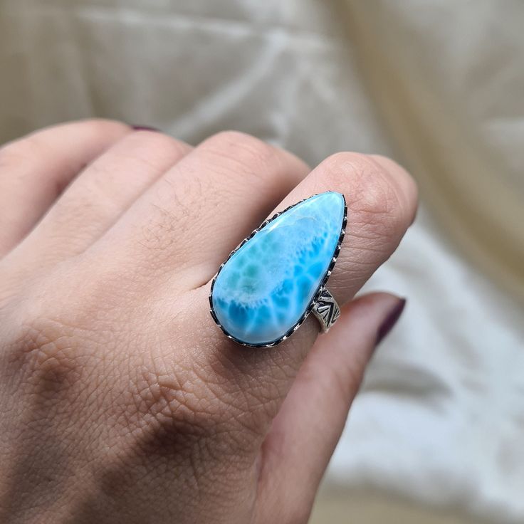 Represent your endless love with our stunning Larimar gemstone Ring symbolizes an everlasting bond, hand crafted beautifully by our artisans. Buy it for yourself or your special one. PRODUCT DETAILS :- 925 Sterling Silver Gemstone: Larimar Gemstone Metal: 925 Sterling Silver Quantity: 1 Piece Feel free to contact us for resizing, personalization or any queries about the product Each of our pieces are made to order. Due to this, it takes 3 to 5 business days after your payment clears to complete Unique Turquoise Larimar Ring, Unique Turquoise Larimar Gemstone Ring, Larimar Turquoise Gemstone Ring For Anniversary, Handmade Turquoise Larimar Rings, Larimar Gemstone Jewelry For Wedding, Unique Larimar Turquoise Ring As Gift, Turquoise Larimar Ring As Gift, Turquoise Larimar Ring For Gift, Handmade Turquoise Larimar Ring For Anniversary