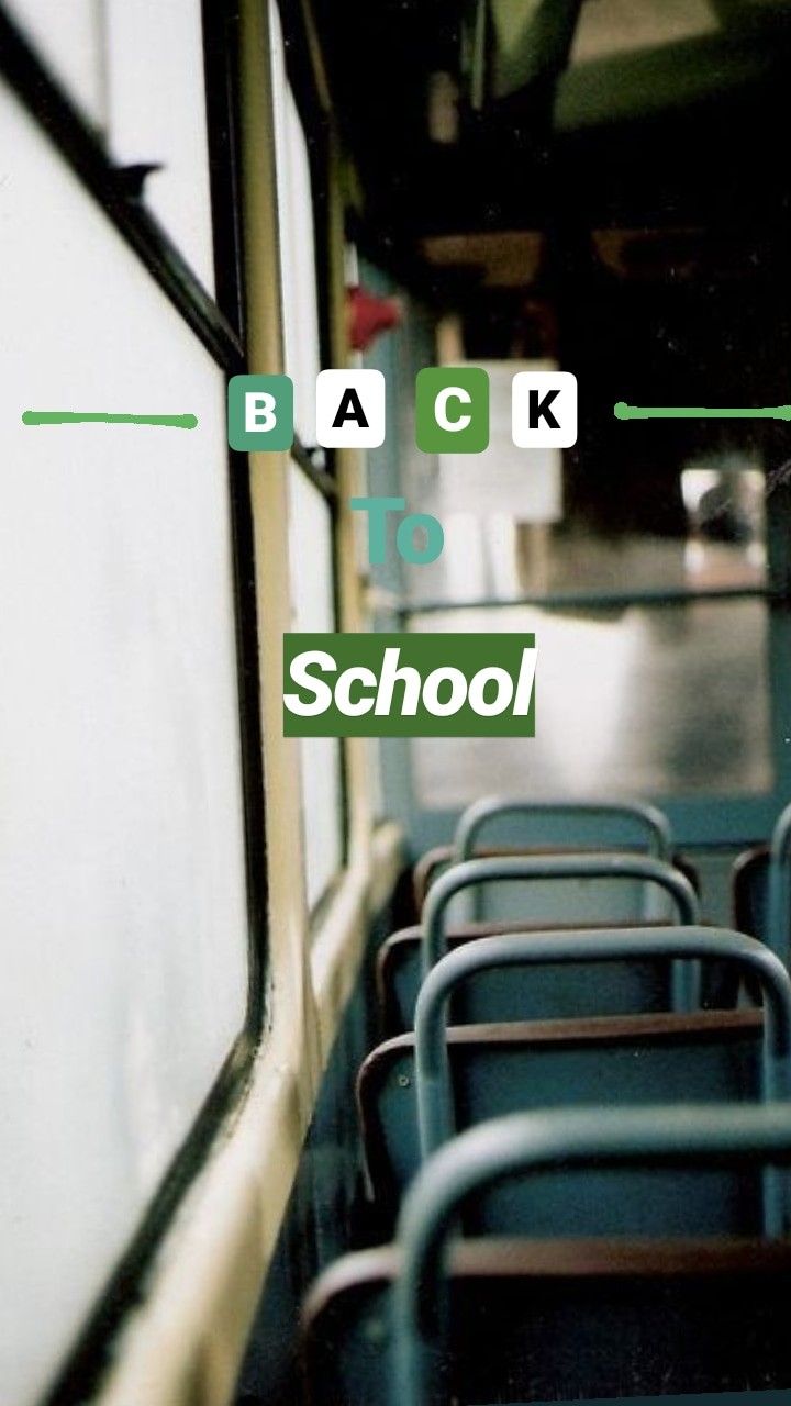 the back to school bus is empty with blue seats and green lettering that reads back to school