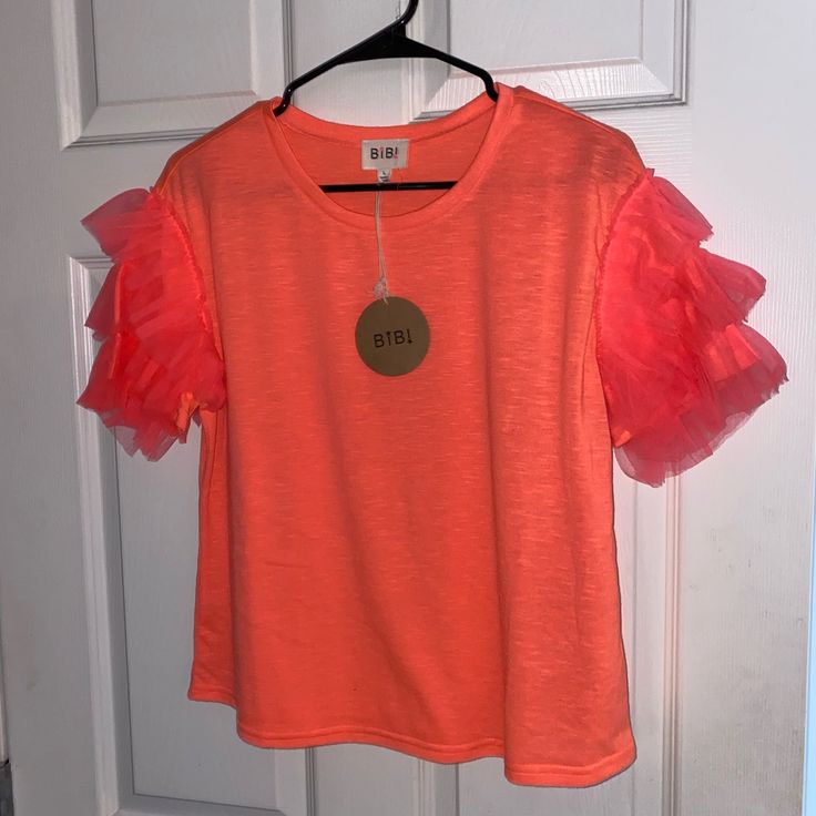 Nwt Bright Coral Ruffle Sleeve T. Size Large, Fits More Like A Medium. Cute Ruffled Crew Neck T-shirt, Cotton Ruffle T-shirt With Flutter Sleeves, Cotton T-shirt With Ruffles And Flutter Sleeves, Trendy Summer Short Sleeve Top With Ruffles, Summer Ruffle T-shirt With Flutter Sleeves, Spring Cotton Ruffle Short Sleeve Top, Pink Ruffled T-shirt, Pink Ruffled Casual T-shirt, Summer Ruffle Flutter Sleeve T-shirt