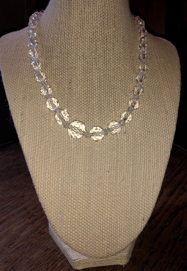 "Graduted crystal necklace, about 16\" long total chain length. I've been told these may be rock crystal, though I believe they are Austrian crystal. Very pretty. Sterling filigree stamped clasp and on chain. good vintage condition, showing gentle wear consistent with age. See pics and zoom in. Sold as found; priced accordingly. Strikingly lovely necklace. Make sure to view all photos and zoom in for details. Pictures are part of the description and it's assumed you've viewed them all." Silver Beaded Crystal Necklace, Adjustable Crystal Necklace With Silver Beads, Clear Faceted Round Beaded Necklaces, Adjustable Crystal Faceted Necklace, Silver Single Strand Round Crystal Necklace, Adjustable Crystal Necklaces With Silver Beads, Crystal Necklaces With Beaded Chain And Round Beads, Clear Crystal Necklaces With Faceted Beads For Jewelry Making, Adjustable Crystal Necklaces For Anniversary