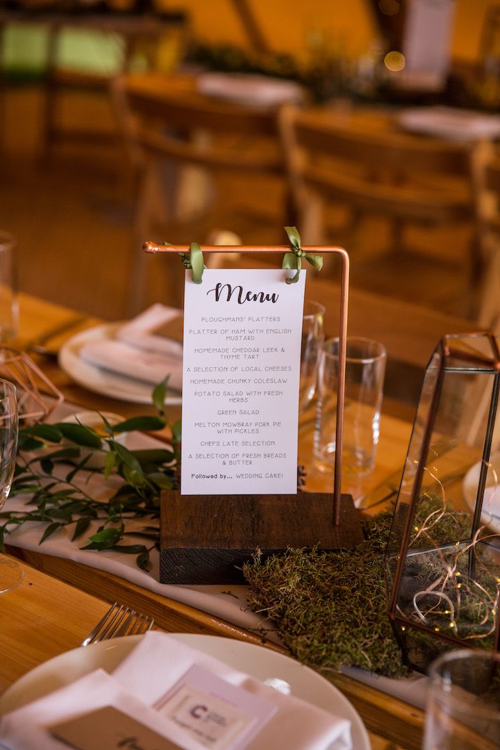 the table is set with menus and place settings