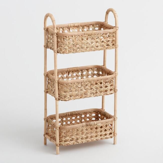 three wicker baskets stacked on top of each other in front of a white background