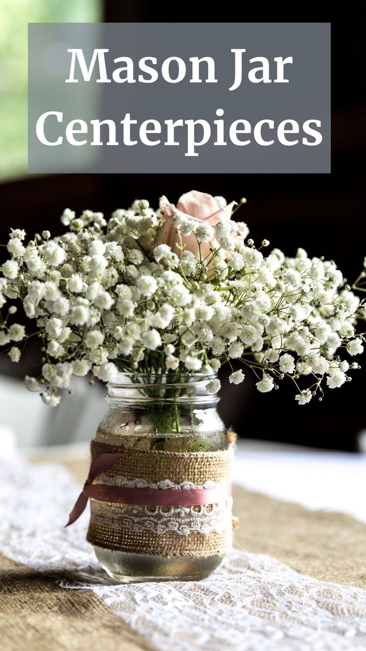 mason jar centerpieces with baby's breath flowers and burlap ribbon