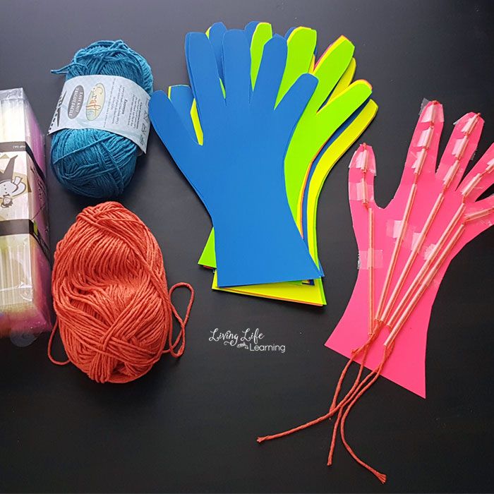 craft supplies are laid out on a table with yarn and crochet hooks