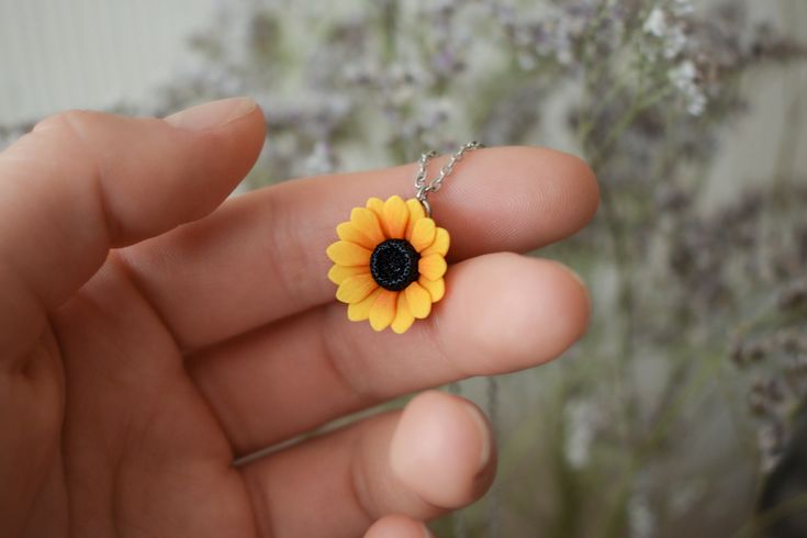 Introducing a sunflower necklace, a mesmerizing piece of handcrafted jewelry. It is shaped completely by hand, without any molds or forms, making each necklace a unique and personalized wearable piece of art. Sunflower blossom is made from high-quality polymer clay and gracefully hangs on a stainless steel chain that is sturdy and will not fade or discolor over time. Matching sunflower earrings ► https://www.etsy.com/listing/1389793031/stud-sunflower-earrings-floral-stud Care: * To maintain the longevity of your polymer clay jewelry, we recommend protecting it from direct sunlight. In case of any dirt, a simple wipe with a wet cloth (avoiding chemicals) will keep them looking pristine. Polymer clay is a durable and slightly flexible material, however, intentionally bending the petals can s Yellow Flower Shaped Jewelry With Sunflower Print, Yellow Flower-shaped Jewelry With Sunflower Print, Yellow Sunflower Print Jewelry For Gift, Yellow Sunflower Print Jewelry As Gift, Yellow Sunflower Print Jewelry Gift, Handmade Polymer Clay Jewelry With Flower Pendant, Handmade Polymer Clay Flower Pendant Jewelry, Yellow Flower Necklaces For Jewelry Making, Flower Charm Polymer Clay Jewelry For Gifts