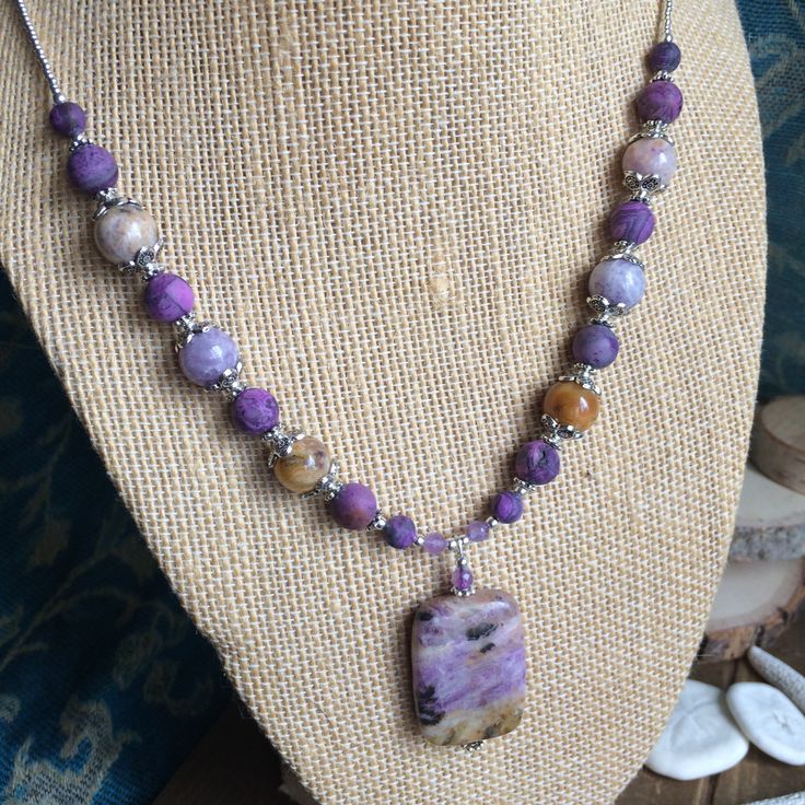 Stone jewelry set necklace earrings purple lepidolite lavender set amethyst crystal handmade beaded boho gift unique jewelry for women SLD. Necklace: 20 inches Earrings: 35mm This jewelry set has a 30mm lepidolite pendant, 6mm-8mm matte purple crazy lace agate stone beads, 10mm lepidolite stone beads, 4mm amethyst gemstone diamond cut gemstone beads, Bali beads, 13/0 silver seed beads, silver plated findings, lobster clasp and ear wires. Lepidolite is a lithium rich mica with many different colo Artisan Purple Adjustable Necklace, Handmade Purple Bohemian Necklaces, Purple Handmade Bohemian Necklaces, Adjustable Lavender Bohemian Jewelry, Adjustable Bohemian Lavender Jewelry, Unique Purple Dangle Necklaces, Purple Bohemian Necklaces For Healing, Handmade Purple Bohemian Beaded Necklaces, Handmade Bohemian Purple Beaded Necklaces