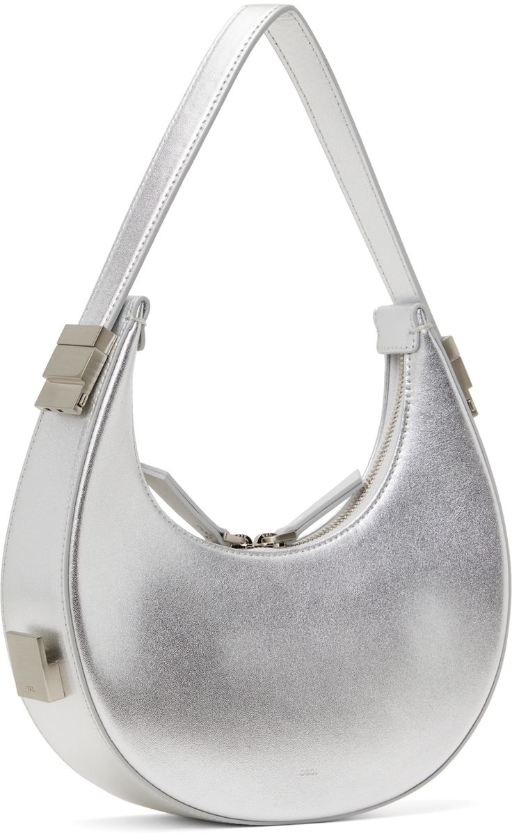 Metallic foil-coated buffed leather top handle bag in silver tone. · Adjustable sliding carry handle · Logo embossed at back face · Two-way zip closure · Patch pocket at interior · Brushed jersey lining · Logo-engraved silver-tone hardware · H4.5 x W8.5 x D2.25 Supplier color: Silver Silver Bodies, Silver Engraving, Metallic Foil, Handle Bag, Leather Top, Emboss, Mini Bag, Patch Pocket, Top Handle