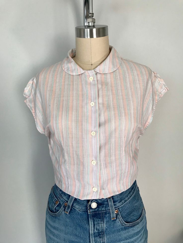 "Vintage Organic Cotton striped shirt.   Peter Pan collar fitted shirt Short sleeves with slits on shoulders Measure: Shoulder to shoulder-16.5\" Armpit to armpit-17.5\" Waist-28\" Total length-24\" size: XS Comes from smoke/pet free home" Vertical Striped Fitted Tops, Casual Collared Blouse With Vertical Stripes, Daywear Striped Blouse With Striped Collar, Classic Striped Tops For Spring, Cotton Tops With Vertical Stripes For Daywear, Cotton Button-up Tops With Vertical Stripes, Striped Collared Blouse For Spring, Fitted Cotton Tops With Striped Collar, Daywear Top With Striped Collar