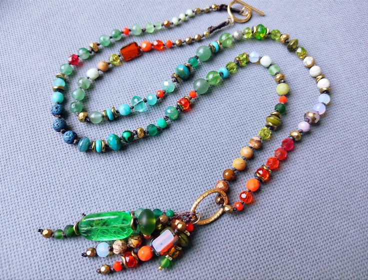 Long necklace in vivid oriental colors made of rich mix of genstones and crystals carefully chosen for this piece. For this necklace I used natural gemstones such as jasper, tiger eye, aventurine, agate, lava as well as Czech glass beads, as their production meets ethical and ecological European standards, and also because they carry a long tradition of Bohemian glass manufacturing. Made with love in my little atelier in the Parisian suburbs. Vintage Multicolor Long Beaded Necklaces, Multicolor Glass Long Beaded Necklace, Vintage Multicolor Long Beaded Necklace, Multicolor Multi-strand Spiritual Beaded Necklaces, Multicolor Multi-strand Crystal Necklaces With Colorful Beads, Indian Colors, Rainbow Colour, Indian Colours, Style Boho