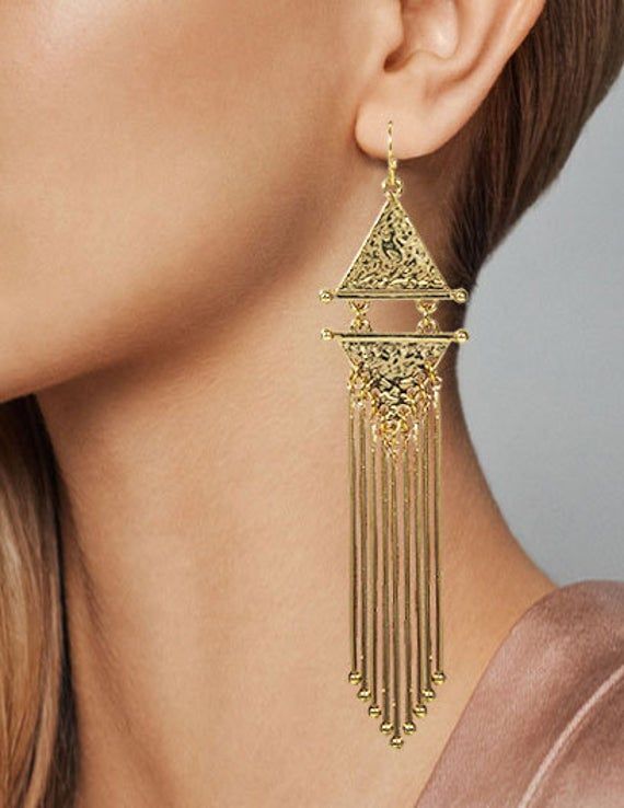 "Metal Tassel Fringe Long Dangle Drop Earrings Available Finished Colors : Gold, Silver This pair of long fringe tassel earrings are classy, stylish and gives a chic look. These Earrings have intricate design, followed by beautiful chains of fringe tassel. Add some sparkle to your outfit with these earrings and feel like a diva! Unique and Beautiful Dangle Earrings A Must Have Jewelry Accessory For Your Collection. Reasonable Prices Designed in NY CITY Measurement: Approx: 5\"(L) Weight : 0.5 Oz Elegant Fringe Metal Chandelier Earrings, Elegant Metal Tassel Earrings With Fringe, Metal Tassel Fringe Drop Earrings, Elegant Long Drop Tassel Chandelier Earrings, Elegant Long Drop Chandelier Earrings With Tassels, Elegant Long Drop Tassel Earrings With Latkans, Elegant Gold Fringe Chandelier Earrings, Elegant Gold Chandelier Earrings With Fringe, Long Drop Fringe Tassel Earrings