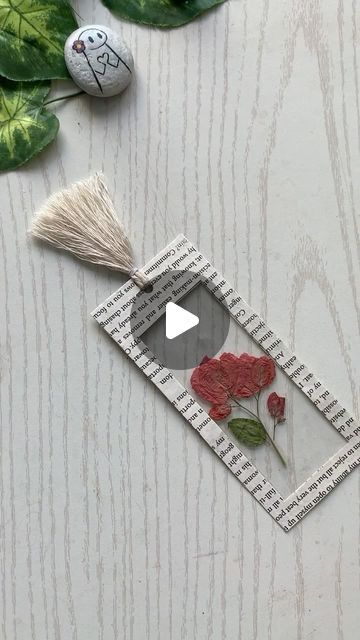 a piece of paper that has been cut out to look like a rose and measuring tape