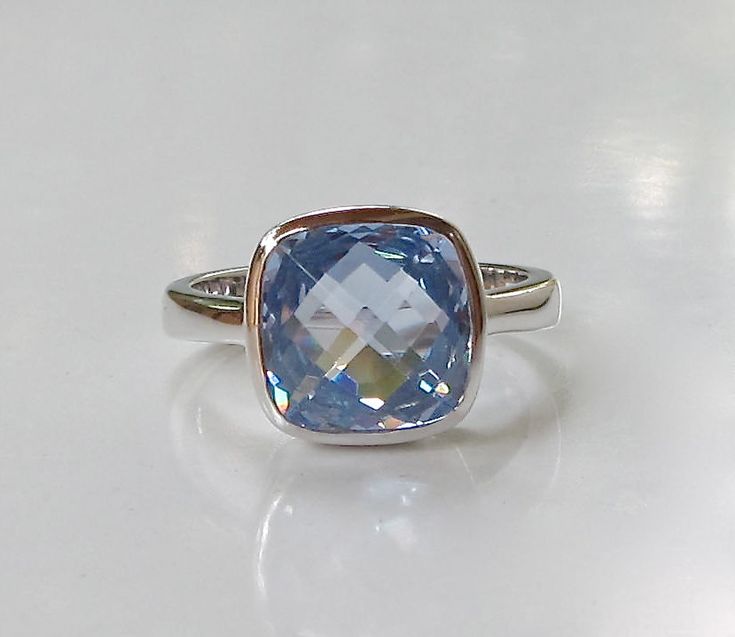 A minimalist classic Square Shaped Blue Quartz hand set in a bezel setting that elegantly holds the stone, featuring handcrafted in sterling silver. This beauty makes a great birthstone ring for those December Birthday gals and a great ring to stack with our other gemstone rings! Wrapped in a box ready for gift giving.(r-b-6) RING INFO ---------------- STERLING SILVER STONE SIZE 9MM (0.35inches) DECEMBER BIRTHSTONE Visit our Ring Section https://www.etsy.com/shop/Belesas?section_id=11187900& Blue Stackable Rings For Formal Occasions, Blue Fine Jewelry Stackable Rings For Formal Events, Blue Minimalist Sterling Silver Stackable Rings, Minimalist Blue Sterling Silver Stackable Rings, Minimalist Blue Topaz Birthstone Ring, Blue Minimalist Stackable Sterling Silver Rings, Formal Blue Fine Jewelry Stackable Rings, Blue Polished Birthstone Ring For Gift, Formal Blue Sterling Silver Stackable Rings