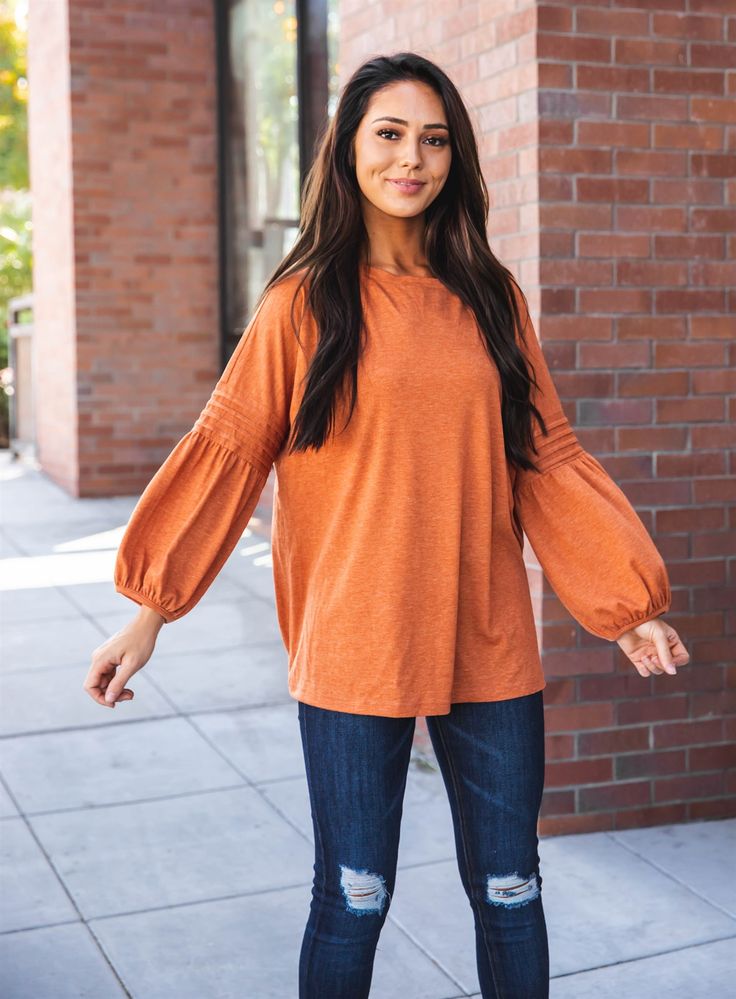 Introducing the 3/4 Pleated Sleeve Casey Top, the perfect addition to your fall wardrobe! This simple yet stylish top is a must-have for those who want to look trendy without sacrificing comfort. The detailed balloon sleeves add just the right amount of sass to your basic jeans, making you stand out from the crowd. Size Small (0-4) Medium (6-8) Large (10-12) XL (12-14) Model is 5'5" Size 2 wearing small Chic Long Sleeve Top With Blouson Sleeves For Fall, Casual Long Sleeve Balloon Top For Fall, Fall Puff Sleeve Long Sleeve Top, Trendy Solid Long Sleeve Puff Top, Trendy Solid Color Long Sleeve Puff Top, Fall Season Solid Color Tops With Balloon Sleeves, Chic Balloon Sleeve Tops For Fall, Solid Balloon Sleeve Tops For Fall, Fall Balloon Sleeve Top In Solid Color