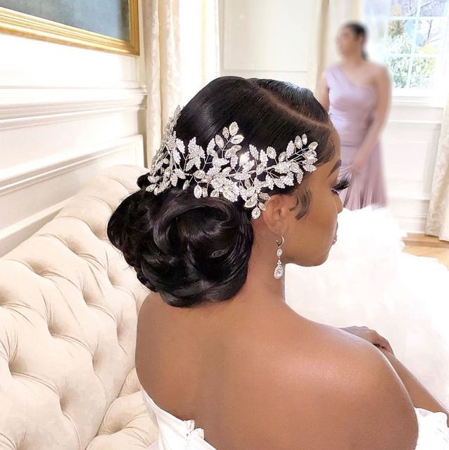 a woman in a wedding dress wearing a bridal hair comb