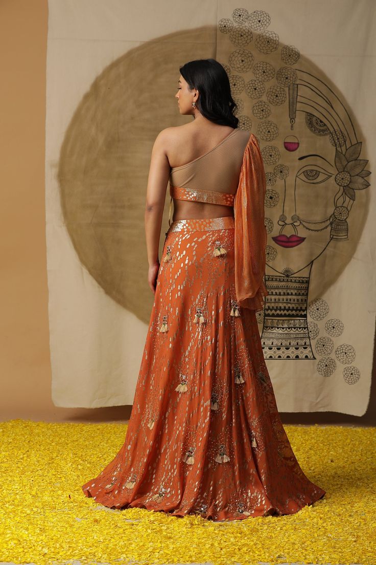 feauring Rust Orange skirt set in gorgette. Comes with sequined blouse and ruffled dupatta Fabric : GEORGETTE ORANGE Color FIT FITTED Lining Material crepe 1 month Delivery 3 Components Orange Sets For Reception And Festivals, Orange Choli With Dupatta For Reception, Orange Lehenga For Festivals And Reception, Orange Lehenga For Reception And Festivals, Orange Pre-draped Saree With Unstitched Blouse For Party, Orange Traditional Wear For Diwali Reception, Orange Traditional Wear For Reception And Diwali, Festive Orange Lehenga With Sheer Dupatta, Orange Choli With Traditional Drape For Reception