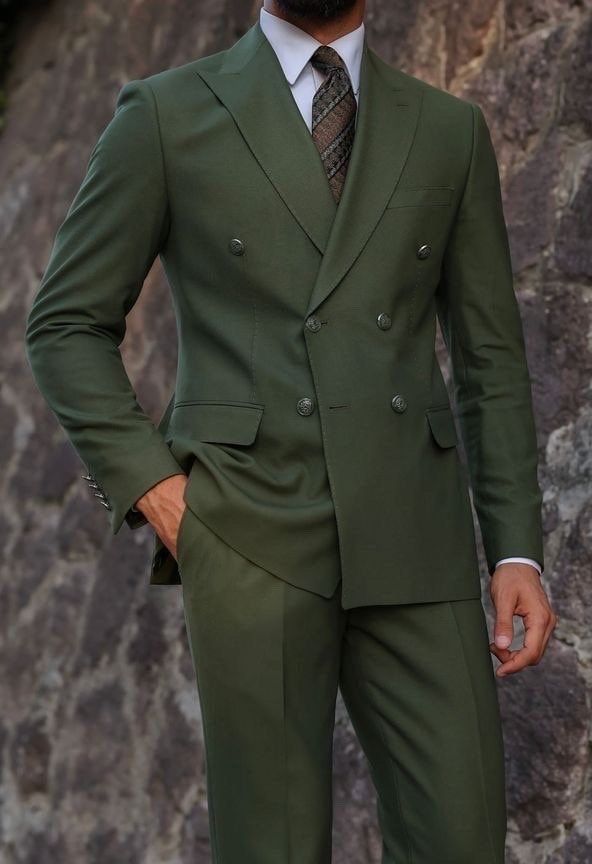 This is a Classy Green color 2 Piece Suit by GoldenfashionStore /crafted from high quality fabric and imported materials. Our products are handcrafted by experienced tailors who make sure the that the stitching is precise, lining is proper and the overall product is sturdy enough to not go out of shape for more than a few years. Also all our products have extra margins in their length, sleeves, sides so it's easily alterable if your size changes after some time. To see more available colours and designs in this collection, Check out the ' Collection' Section. *This is a 2 piece set of a Coat+pant  *We also offer customization so we can provide you an even better fit if you massage us your measurements (in inches) of Chest, Stomach, Waist, Hip, Shoulder and Actual Height after ordering. *Wa Slim Fit Double-breasted Semi-formal Suit, Semi-formal Slim Fit Double-breasted Suit, Party Suits With Double-breasted Button And Notch Lapel, Double-breasted Tuxedo Blazer For Groom, Double-breasted Tuxedo Three-piece Suit For Groom, Double-breasted Tuxedo Suits In Suiting Fabric, Fitted Double-breasted Suit For Groom, Fitted Double-breasted Three-piece Suit For Groom, Tailored Double-breasted Tuxedo For Groom