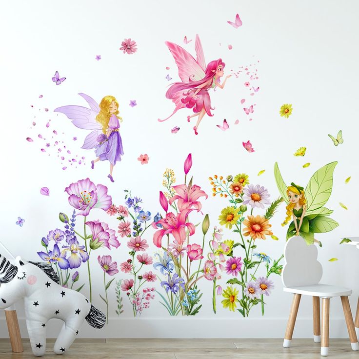 a child's room with flowers and fairy wall decals