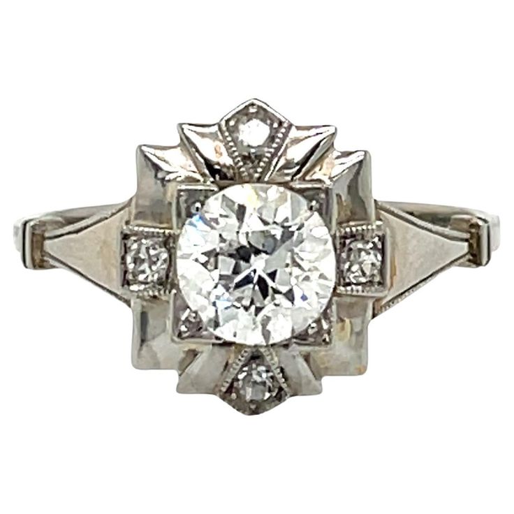 An exquisite Art Deco ring, hand-crafted in 18k white gold, authentic from 1930, featuring in the center sparkling Old European cut Diamond weighing .90 carat, surrounded by 0,10 carats of smaller diamonds. The ring is original in every part, excellent condition 10/10. CONDITION: Pre-Owned - Excellent METAL: 18k gold GEM STONE: Diamond 1,0 total carats DESIGN ERA: 1930 - Art Deco RING SIZE: US 7, Resizable on request, free of charge WEIGHT: 2,5 grams * The jewel comes with Gemological card and w 1930 Art, Filigree Engagement Ring, Ring Hand, Deco Ring, European Cut Diamonds, Art Deco Diamond, Art Deco Ring, Gem Stone, Jewelry Rings Engagement