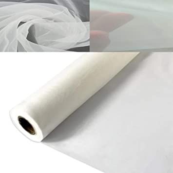 white plastic sheeting on top of a table next to a roll of tissue paper