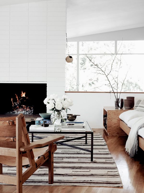 a living room filled with furniture and a fire place