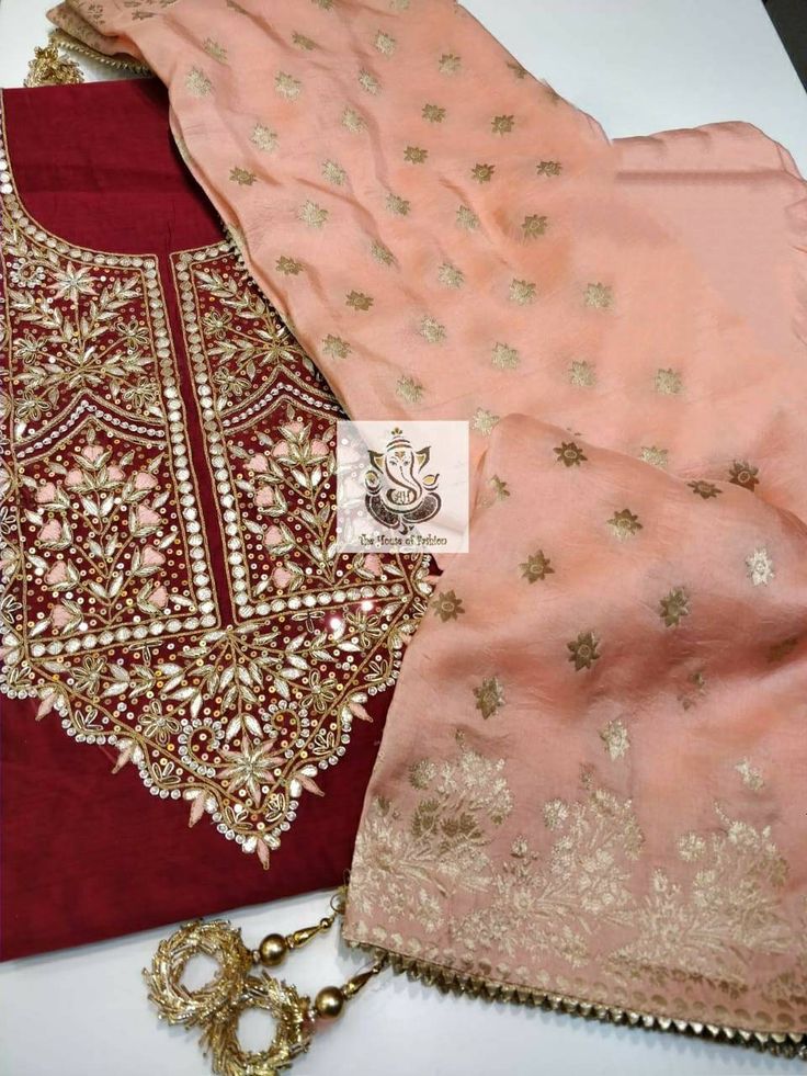 Item Overview ATHARVA Hand Embroidered Salwar Kameez w/EmbroideredNeck on Maroon/Banarsi Silk Dupatta/ Customized Stitching/Wedding/CH1128 Fabric: * Shirt Chanderi Silk- 2.5 Mts - with Hand Embroidered Neck * Dupatta: Banarsi Silk Dupatta (Motifs may wary) * Bottom Santoon Silk 2.5 Mts. Excusive Hand Embroidered Party Wear Punjabi Suit. Customization: * Fabrics: Designs Can be made in different Fabrics. * Stitching Available Care: * Dry Clean/ Avoid direct Ironing on Embroidery Part. * Lining is Semi-stitched Embroidered Sharara In Shantoon, Gold Embroidered Jamawar Sharara, Gold Embroidered Jamawar Salwar Kameez, Semi-stitched Embroidered Shantoon Sharara, Semi-stitched Banarasi Silk Sharara With Dabka Work, Anarkali Salwar Kameez In Dola Silk For Traditional Ceremonies, Semi-stitched Chinon Salwar Kameez With Intricate Embroidery, Unstitched Embroidered Jamawar Salwar Kameez, Gold Embroidered Shantoon Salwar Kameez