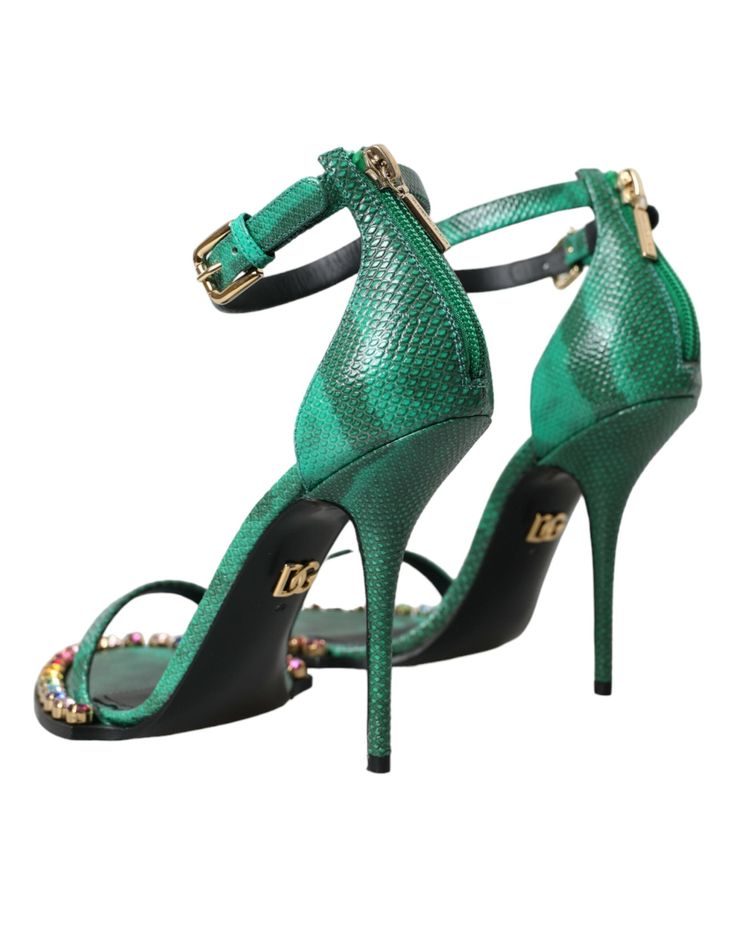 Dolce & Gabbana ankle strap heels sandals with crystal embellishment. Made from high-quality exotic leather, these sandals feature a chic crystal embellishment that will elevate any outfit. Expertly crafted in Italy, they also boast a durable leather sole and a convenient buckle closure to keep your feet secure and comfortable throughout the day. Model: Heeled sandals Color: Green Material: Leather Sole: Leather Buckle closure 100% Exotic Snakeskin Leather Made in Italy