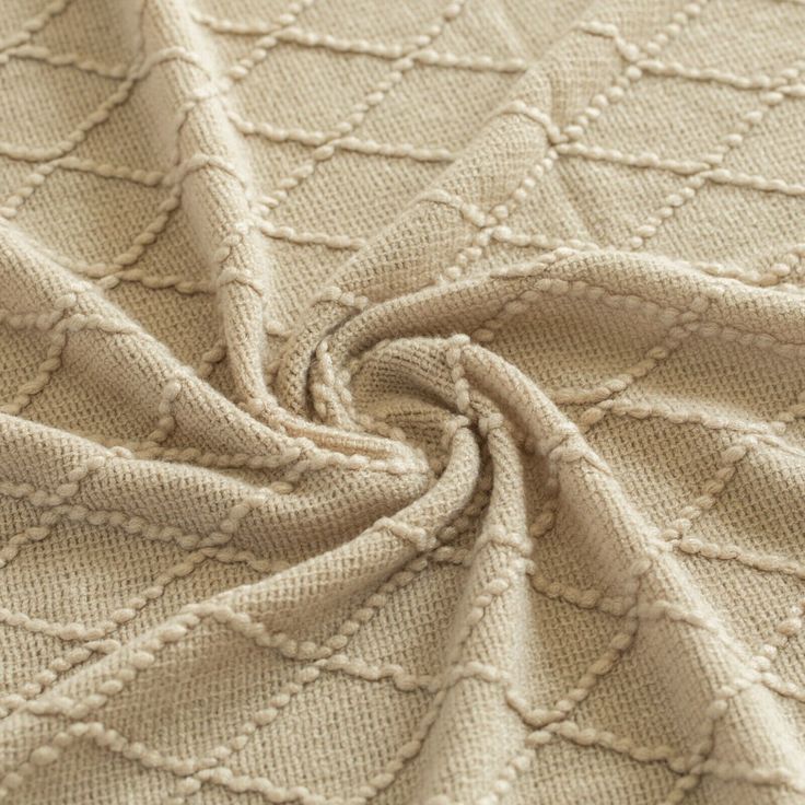 a close up shot of the texture of a knitted blanket