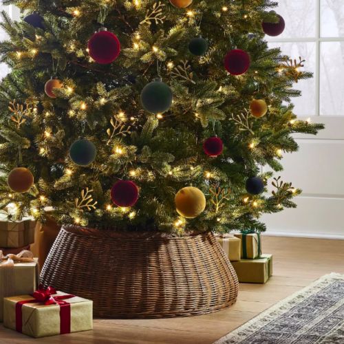 a decorated christmas tree with presents under it