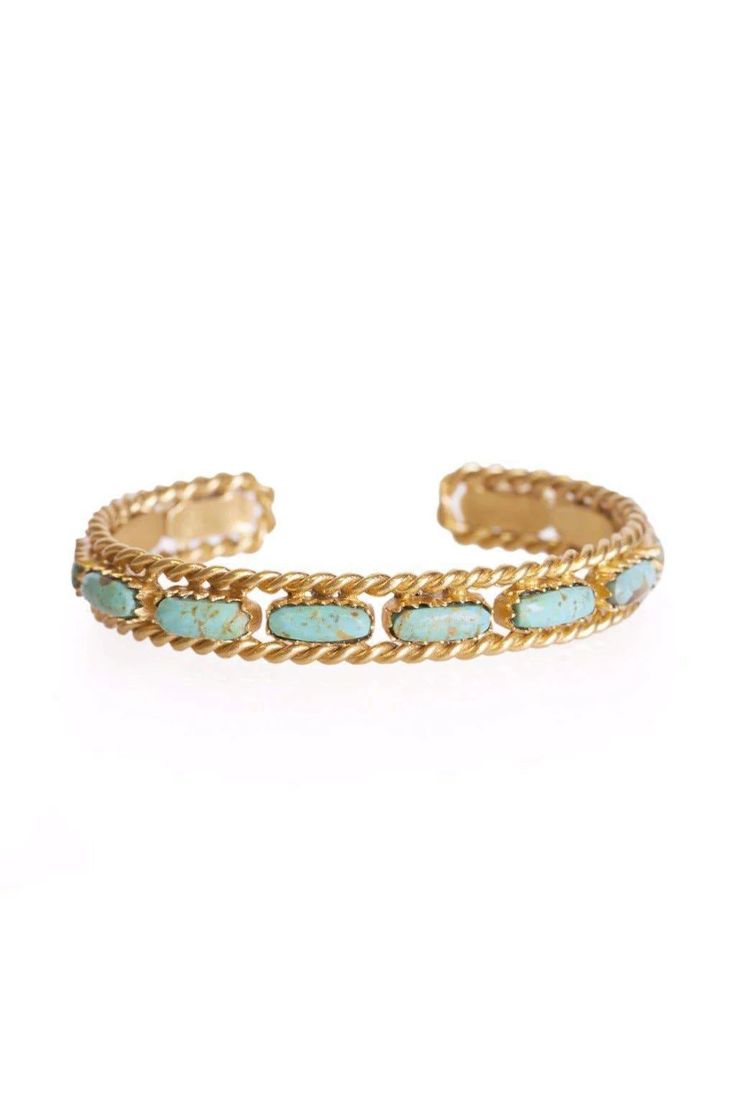 Handcrafted of 18K gold plated brass and turquoise stones, this gorgeous yellow gold cuff marries refined authenticity and classic elegance. Features a chain texture with turquoise stones running along the center adding beautiful contrast. Timeless in style, it is perfect worn solo or styled with your favorite layered look. Pairs with casual and dress styling. Due to the one-of-a-kind nature of the turquoise, exact colors and patterns may vary slightly from the image shown. 18k gold plating over Dress Styling, Turquoise Bracelet Cuff, Gold Cuffs, Turquoise Cuff, Jewelry Lookbook, Turquoise Stones, Dream Jewelry, Layered Look, Gold Bangles