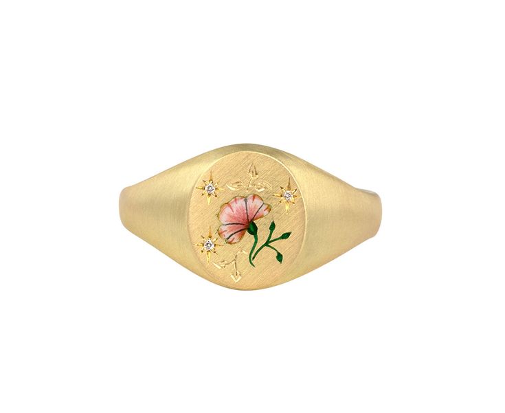 With its stunning, hand done details and subtle shimmer, this Cece Jewelry ring is a perfectly feminine take on the traditional signet ring. The matte 18K yellow gold oval ring face has been delicately painted with a pale pink Champlevé enamel rose, engraved with tiny leaves and then set with three tiny diamonds. The composition is set at the center of the matte 18K yellow gold band. 18K yellow gold and enamel ring face : just under 1/2" x 3/8"diamonds : 1mm diameter each18K yellow gold band wid Signet Ring Women, Gold Oval Ring, Signet Rings Women, Rebecca Overmann, Diamond Signet Ring, Pippa Small, Oval Ring, Tiny Diamond, Oval Rings