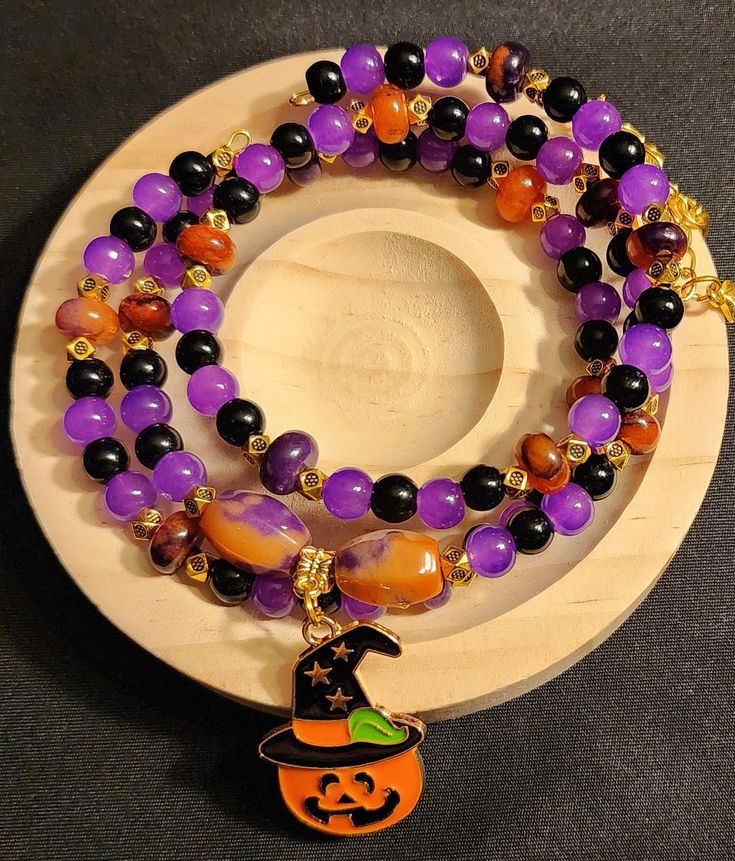 Beautiful Halloween Jack O Lantern wrapped/Stacked glass beaded bracelet. High quality materials. Bohemian Bracelets For Halloween Gift, Bohemian Halloween Gift Bracelets, Halloween Gift Stretch Bracelet With Round Beads, Handmade Bohemian Bracelets For Halloween, Bohemian Handmade Bracelets For Halloween, Bohemian Halloween Jewelry With Round Beads, Beaded Bracelets For Halloween Gift, Handmade Beaded Bracelets For Halloween, Adjustable Multicolor Beaded Bracelets For Halloween