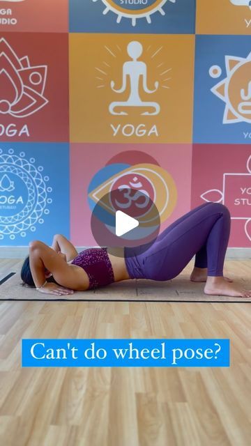 a woman doing yoga poses in front of colorful wall with the words can't do wheel pose?