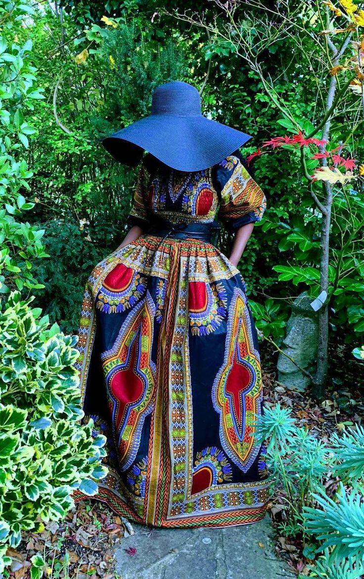 An exquisite black dashiki maxi dress. The smocking at the top gives with the full skirt gives a flattering silhouette. It has full sleeves that can be worn in a puff style or elongated. 100% Cotton Hand made in Ghana. Length 58" appx Care Hand wash in cool water. Drip dry. Dry away from direct sunlight. Iron on medium heat. Black Long Sleeve Dress In Ankara Fabric, Black Ankara Fabric Maxi Dress, Full Maxi Dress, Thanksgiving Dressing, Dashiki Dress, Thanksgiving Dress, Water Drip, Shopify Design, Style Maxi Dress