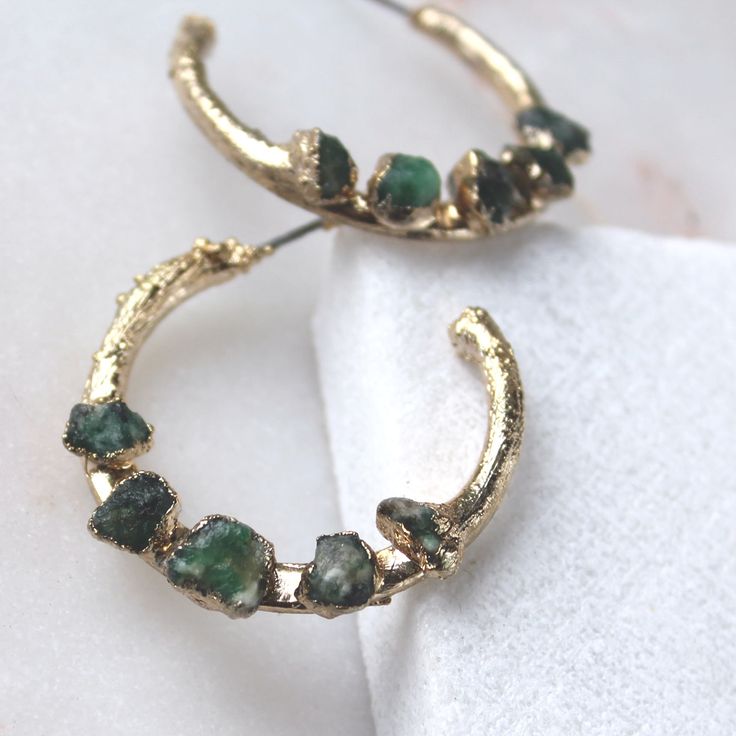 "emerald earrings | may birthstone | raw emerald earrings | raw crystal earrings | hoop earrings | birthstone earrings | emerald hoops Raw emerald dipped in 18k gold. These earrings measure 1\" Nature is a strong force flowing through our jewelry. We let the raw gemstones do the talking. Each unique stone determines the shape and style each design will take on. In return, we achieve an organic and luxe feel. All of our jewelry is one of a kind. ::The process of gold dipping:: Handpicked stones a Raw Crystal Earrings, Blue Stones Jewelry, Herkimer Diamond Earrings, Raw Stone Earring, Raw Crystal Ring, Raw Emerald, Earrings Emerald, Vintage Jewellery Rings, Organic Jewelry