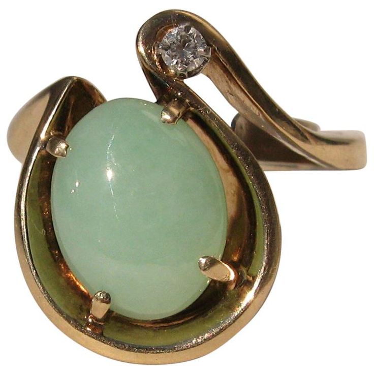 Stunning 14K gold Green Jade & Diamond Cocktail ring. center jade, measuring 14.10mm x 11.35mm x 5.0mm. Approximately 6.5 Carats. Diamond is a accent at about .5 points. Heavy free form almost horseshoe looking motif on this ring. The ring has a sizer inside of the band that allows several sizes to wear this, from a 7.5 to a 9. This is out of a massive collection of Contemporary designer & Vintage clothing as well as Hopi, Zuni, Navajo, Southwestern, sterling silver, costume jewelry, and fine je Silver Costume, 1st Dibs, Jewellery Rings, Diamond Cocktail Ring, Jade Bangle, Diamond Cocktail Rings, Crystal Stars, Designer Vintage, Green Jade